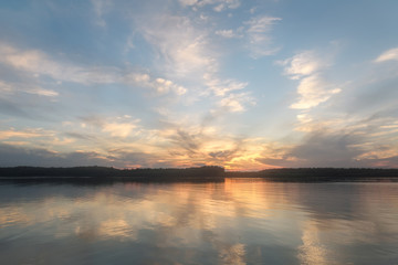 Fototapeta na wymiar river clouds sky sunset reflections