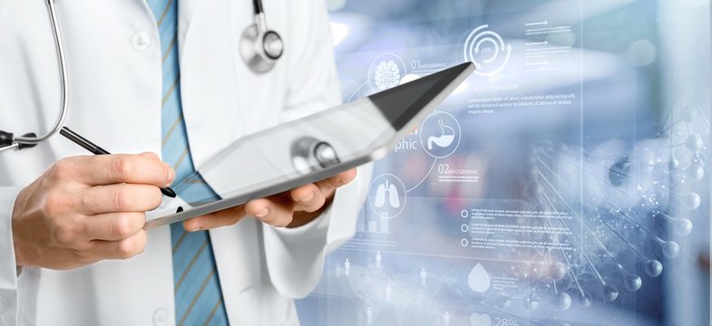 Man doctor using digital tablet
