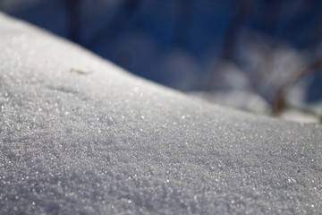 winter snowy snowdrift on a sunny afternoon closeup