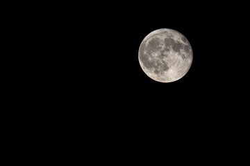 Naklejka premium Full moon on a clear sky in Caceres, Spain