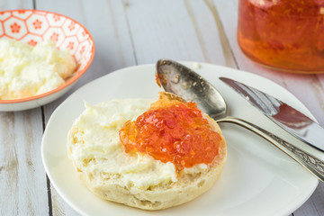 Biscuit sandwich with butter spread and habanero jelly.