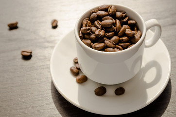 The Cup is filled with coffee beans.