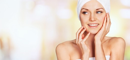 Young beautiful healthy woman with white towel