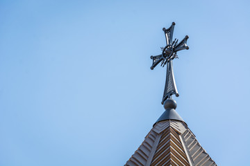 Beautiful cross of an Armenian church against a blue sky.