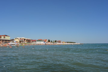 Beach with a tourist on the shore of the Black Sea, sea rest and relaxation