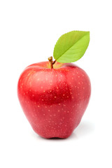 Ripe red apple with leaf isolated.