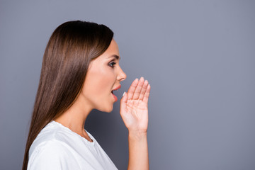 Side-view profile portrait of attractive woman telling news, sho