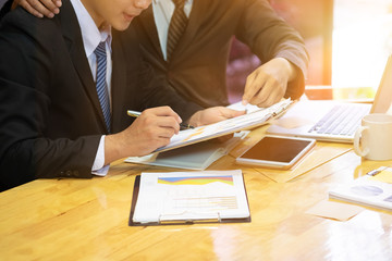 Manager consult a rookie young business on workplace with vintage tone.