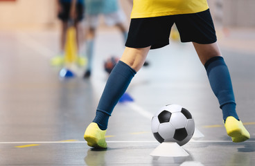 Indoor soccer players training with balls. Indoor soccer sports hall. Football futsal player, ball,...