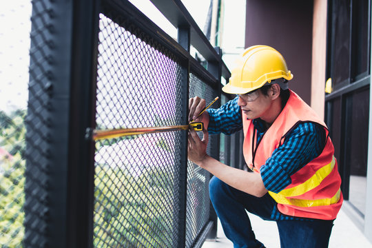 Inspector use measuring tape to measure balcony after renovation building
