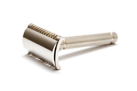 A traditional nickel plated open comb safety razor