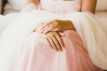 Detail of a white and elegant wedding dress.