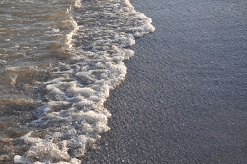 sea ​​surf at sunset. background, texture