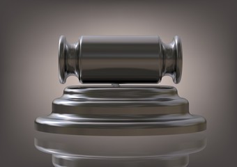 Silver hammer of the judge on a gray 