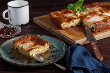 Homemade pear pie on rustic wooden table.
