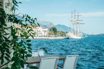 cafe with beautiful view at blue sea water. mountains on background