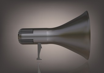 A silver speaker on a gray
