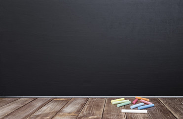 empty blackboard and chalk on the wood table