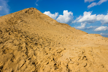 sand dune on the background of cloudy sky