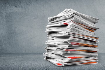 File folders with documents on white table