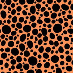 seamless pattern with black random circles on beige
