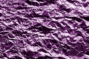 Metal foil texture in purple color.