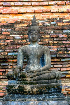 Ancient buddha statue with old pagoda of thailand