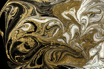 Marble abstract acrylic background. Marbling artwork texture. Agate ripple pattern. Gold powder.