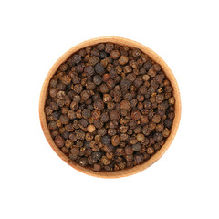 Wooden bowl full of black peppercorns