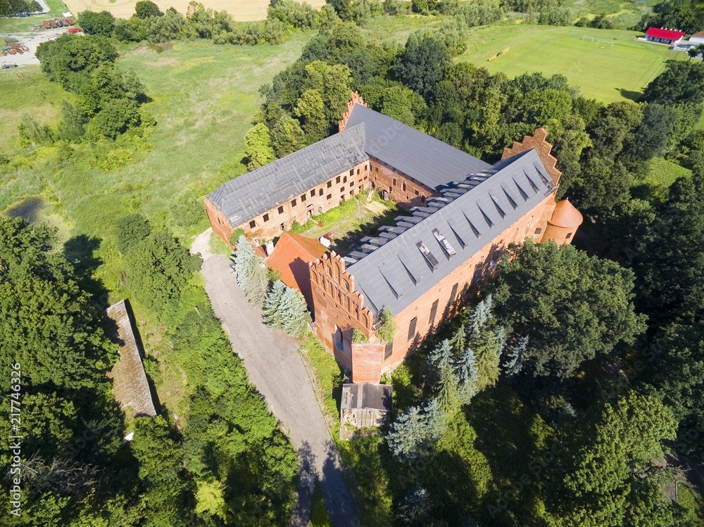 Wall mural Aerial view of ruins of medieval teutonic knights castle in Barciany, Poland (former Barten, East Prussia)