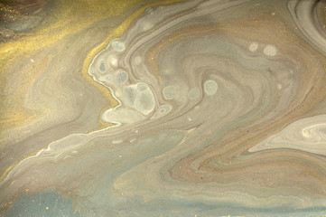 Obraz premium Gold marbling texture design. Beige and golden marble pattern. Fluid art.