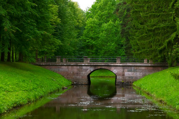 old stone bridge in a summer park