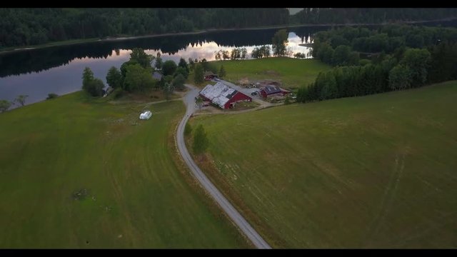 AERIAL: Old Norwegian farm at the river