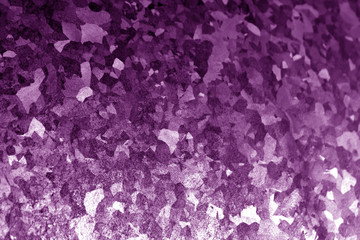 Metal surface with scratches in purple tone.