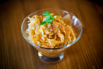 stewed cabbage with carrots in a glass bowl