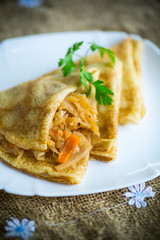 thin fried pancakes stuffed with stewed cabbage in a plate