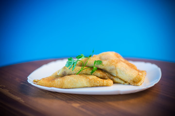 thin fried pancakes stuffed with stewed cabbage in a plate