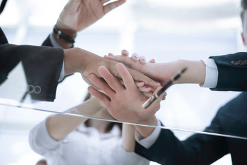 bottom view.closeup.business team showing in the their unity