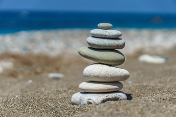 Fototapeta na wymiar Pepels pyramid on a sandy beach in Cyprus