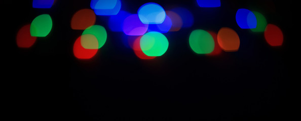 blurred colorful lights on black background .photo with copy sp