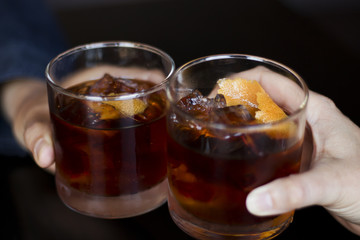 Two Rye Whiskey Cocktail Drinks Toasted Together