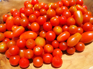 Fresh cherry tomatoes in a wooden bowl