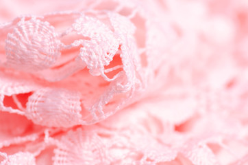 Fototapeta na wymiar Pink fabric material lace flower texture macro blur background