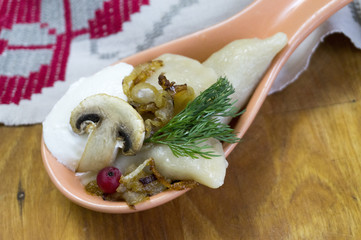 Traditional Russian food dumplings or vareniki, dough with meat or other stuffing, with flour and...