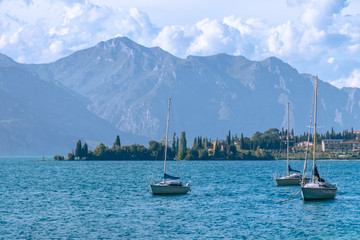 view of boats on Lake Garda and mountains in the background