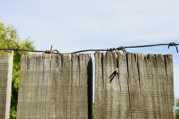 Fence with barbed wire.