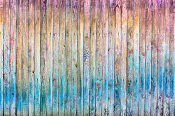 Wooden fence painted in Rainbow, old Rainbow background,texture