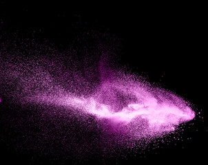 Abstract purple powder explosion on black background, Freeze motion of purple dust splashing.