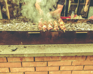 Marinated shashlik preparing on a barbecue grill over charcoal. Roasted stacked meat Shish kebab popular in Goergia. Traditional cuisine in Georgia
