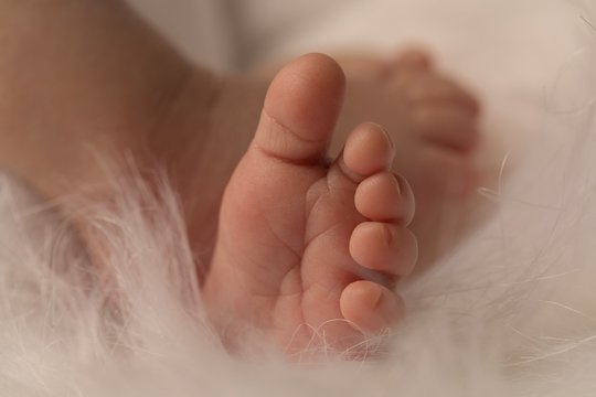 Newborn baby sleeping on baby bed